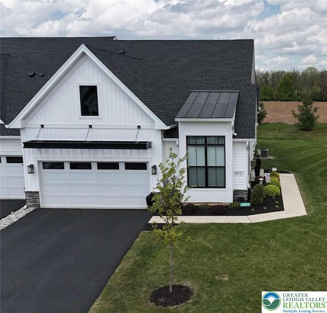 6907 Cedar Dr, East Allen Twp, PA 18014 - modern inspired farmhouse featuring a standing seam roof, a shingled roof, driveway, and board and batten siding