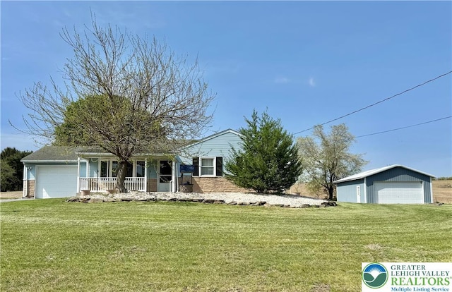 8173 Holbens Valley Rd, Weisenberg Twp, PA 18066 - single story home with a porch, a front yard, and a garage