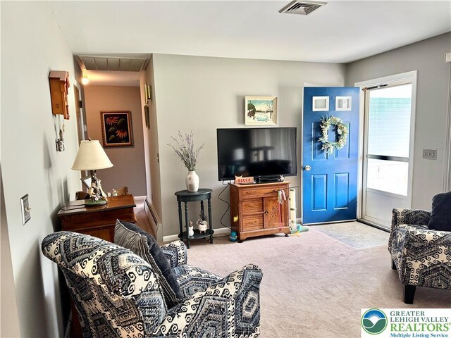 8173 Holbens Valley Rd, Weisenberg Twp, PA 18066 - carpeted living room featuring a baseboard heating unit and baseboards