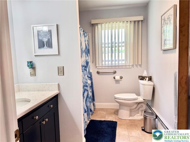 8173 Holbens Valley Rd, Weisenberg Twp, PA 18066 - full bath featuring toilet, baseboard heating, tile patterned flooring, baseboards, and vanity