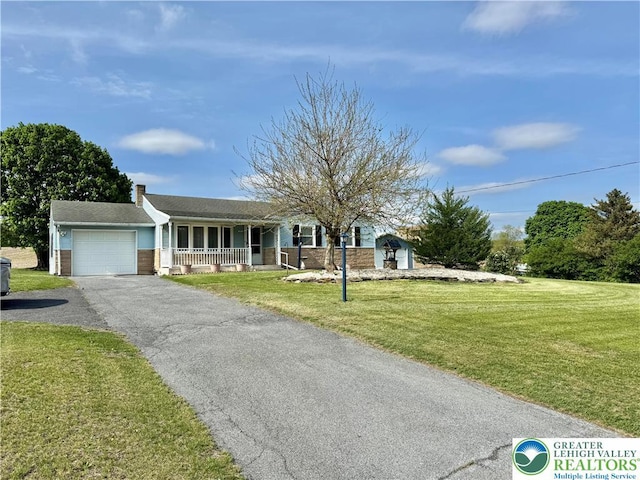 8173 Holbens Valley Rd, Weisenberg Twp, PA 18066 - single story home featuring a porch, an attached garage, driveway, a front yard, and a chimney