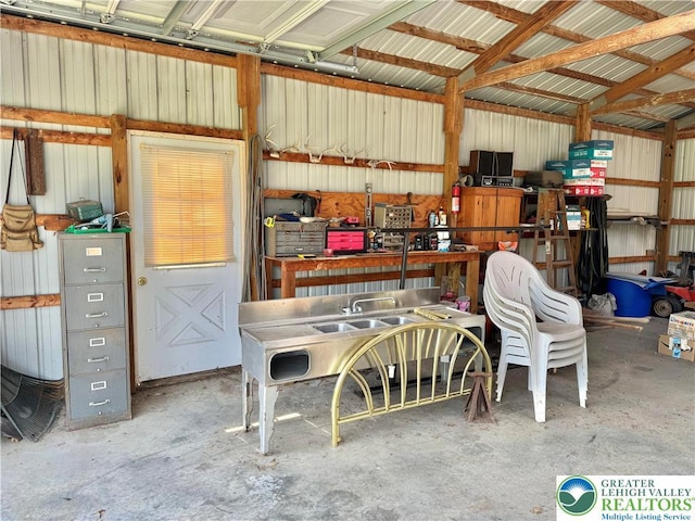 8173 Holbens Valley Rd, Weisenberg Twp, PA 18066 - garage with metal wall and a workshop area