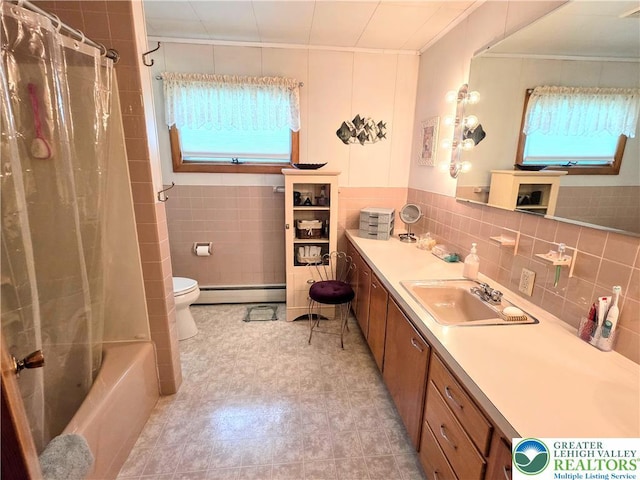 bathroom featuring crown molding, a baseboard radiator, tile walls, vanity, and toilet