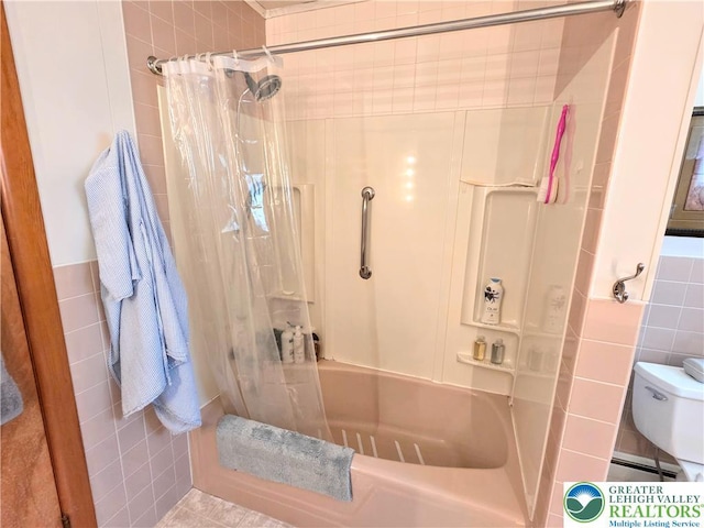 full bathroom with tile walls, toilet, shower / bathtub combination with curtain, and a baseboard heating unit