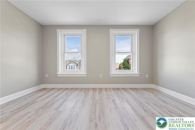 410 E Hamilton St, Allentown City, PA 18109 - spare room featuring light wood-style floors, healthy amount of natural light, and baseboards