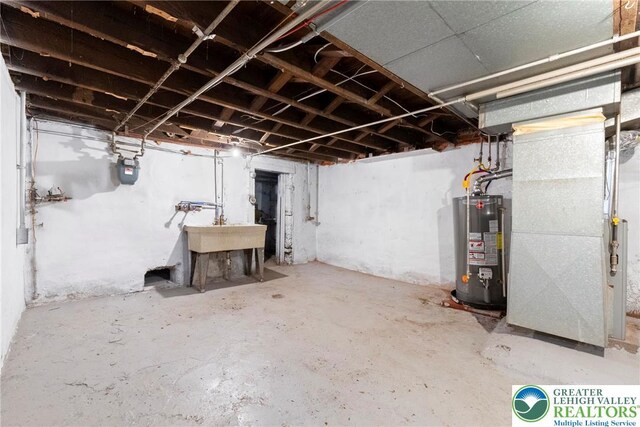 410 E Hamilton St, Allentown City, PA 18109 - unfinished basement featuring gas water heater, gas meter, a sink, and heating unit