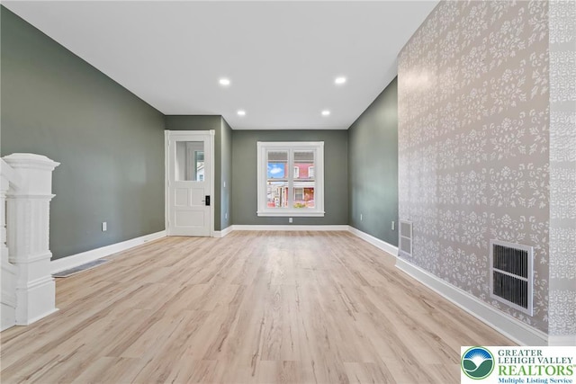 410 E Hamilton St, Allentown City, PA 18109 - unfurnished living room featuring wood finished floors, baseboards, and recessed lighting
