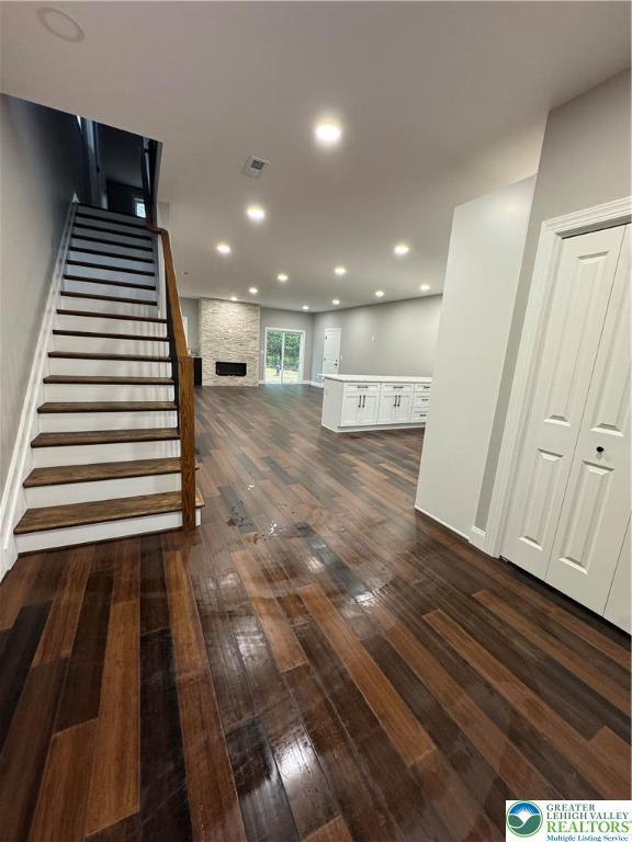 211 Maxatawny Dr, Coolbaugh Twp, PA 18347 - interior space featuring hardwood / wood-style flooring, a large fireplace, recessed lighting, and baseboards