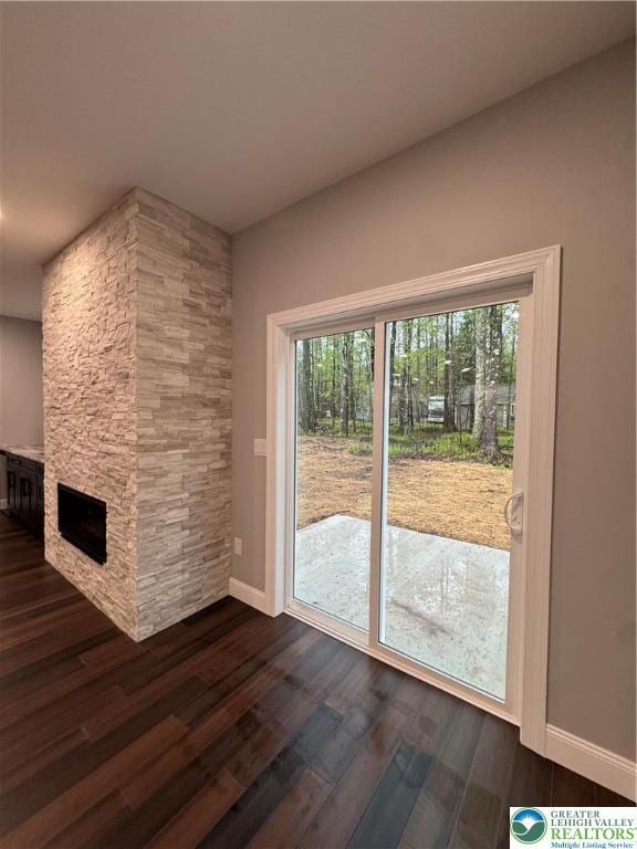 211 Maxatawny Dr, Coolbaugh Twp, PA 18347 - unfurnished living room with dark wood-style flooring and baseboards
