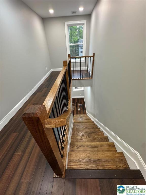 211 Maxatawny Dr, Coolbaugh Twp, PA 18347 - staircase with wood finished floors and baseboards