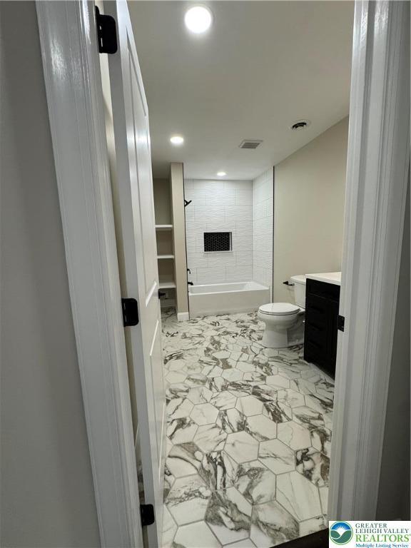 211 Maxatawny Dr, Coolbaugh Twp, PA 18347 - full bathroom featuring marble finish flooring, recessed lighting, toilet, vanity, and washtub / shower combination