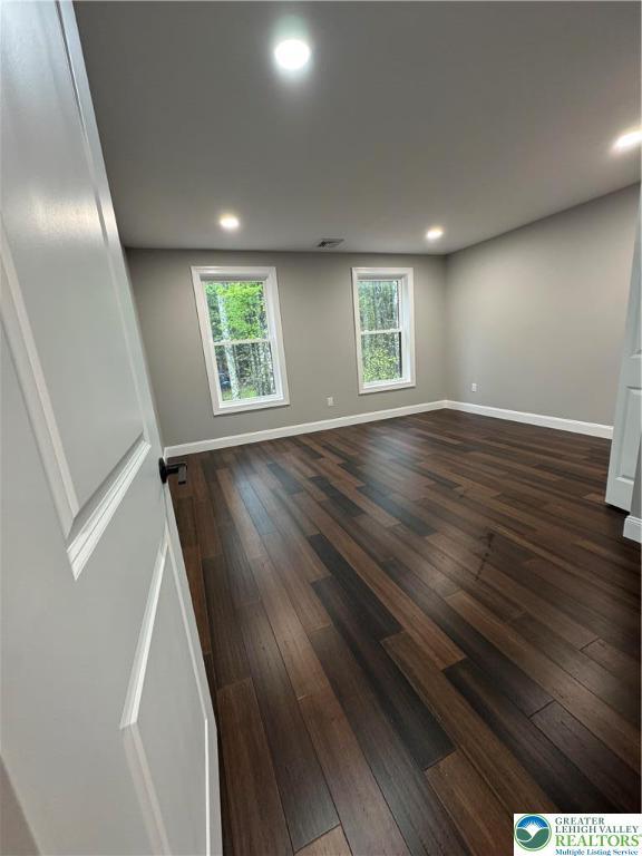 211 Maxatawny Dr, Coolbaugh Twp, PA 18347 - unfurnished room with dark wood-type flooring, baseboards, and recessed lighting