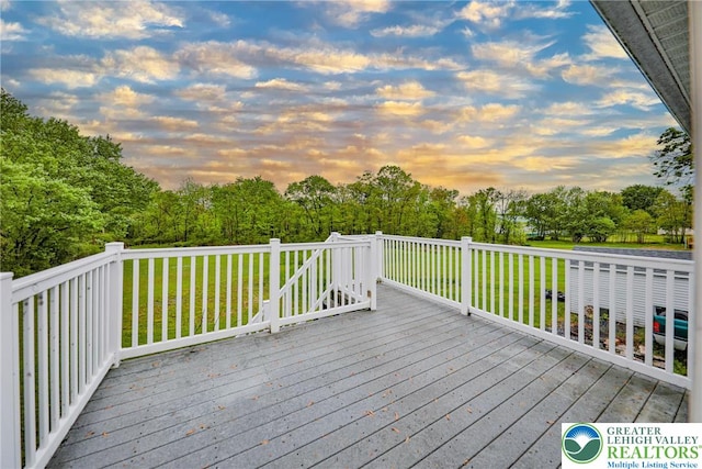 4579 W Mountain View Dr, Lehigh Twp, PA 18088 - deck featuring a lawn and view of wooded area