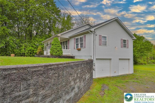 4579 W Mountain View Dr, Lehigh Twp, PA 18088 - view of side of property featuring a garage and a yard