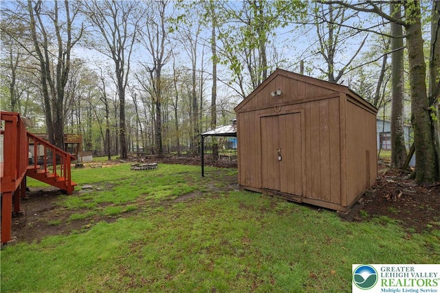 1918 Horseshoe, Coolbaugh Twp, PA 18466 - view of grassy yard featuring a storage shed, an outdoor structure, and stairs
