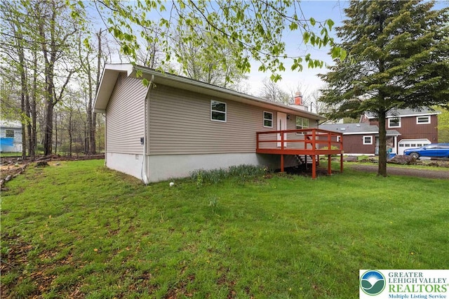 1918 Horseshoe, Coolbaugh Twp, PA 18466 - rear view of house with a deck, a lawn, and a chimney