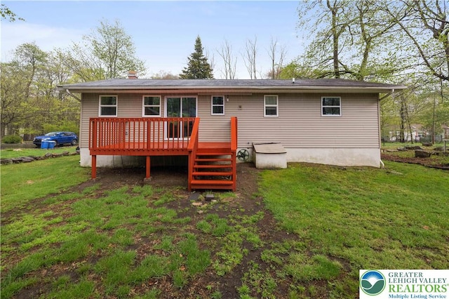 1918 Horseshoe, Coolbaugh Twp, PA 18466 - back of property with a wooden deck and a yard