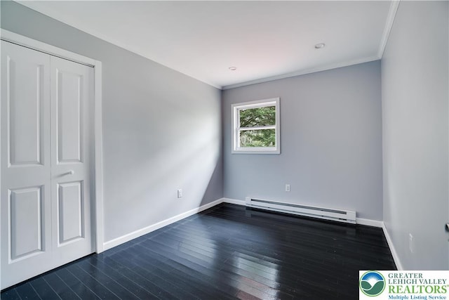 1918 Horseshoe, Coolbaugh Twp, PA 18466 - unfurnished bedroom with baseboard heating, dark wood-style floors, baseboards, and ornamental molding