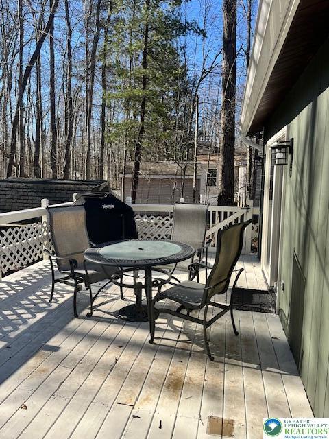 266 Maxatawny Dr, Coolbaugh Twp, PA 18347 - wooden deck with outdoor dining space