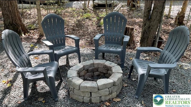 266 Maxatawny Dr, Coolbaugh Twp, PA 18347 - view of patio with an outdoor fire pit