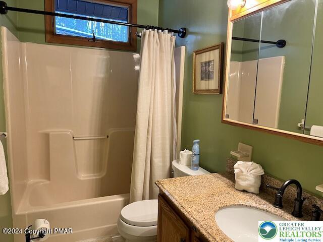 266 Maxatawny Dr, Coolbaugh Twp, PA 18347 - bathroom featuring toilet, shower / tub combo, and vanity
