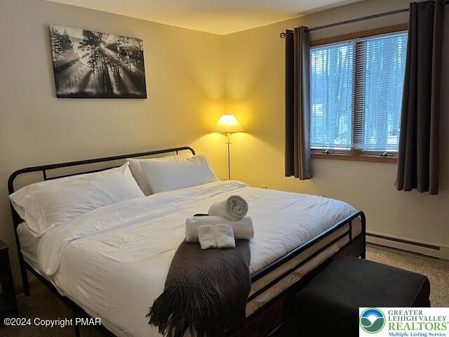 266 Maxatawny Dr, Coolbaugh Twp, PA 18347 - bedroom featuring a baseboard heating unit