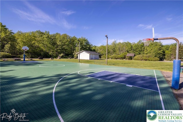 266 Maxatawny Dr, Coolbaugh Twp, PA 18347 - view of sport court with community basketball court, a yard, and view of scattered trees