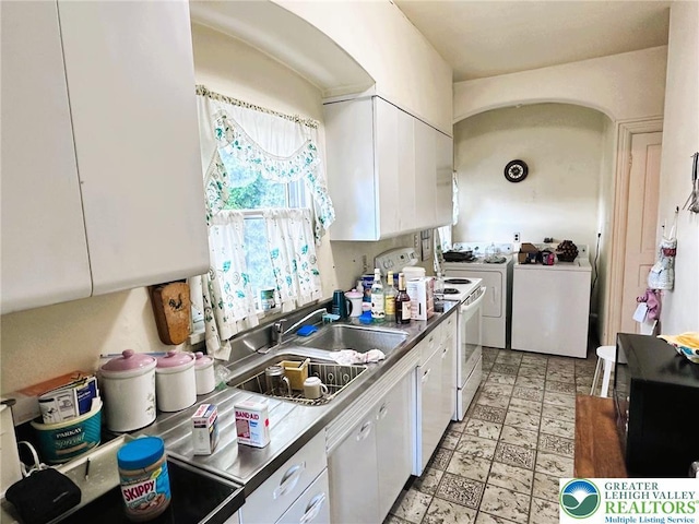 520 2nd St, Catasauqua Borough, PA 18032 - kitchen featuring a sink, white cabinets, separate washer and dryer, and black microwave