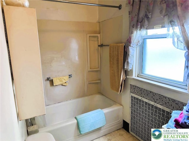 520 2nd St, Catasauqua Borough, PA 18032 - full bathroom with bathing tub / shower combination, tile patterned floors, and radiator