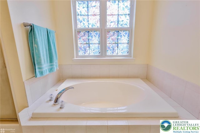 full bath featuring a bath