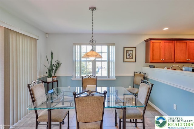 dining area featuring light tile patterned floors and recessed lighting
