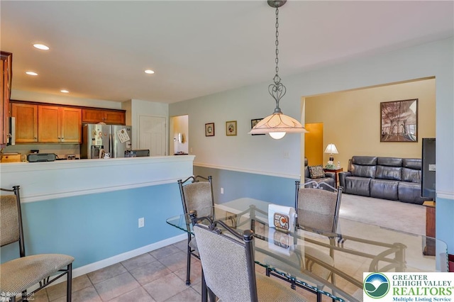 dining room featuring recessed lighting and light tile patterned floors