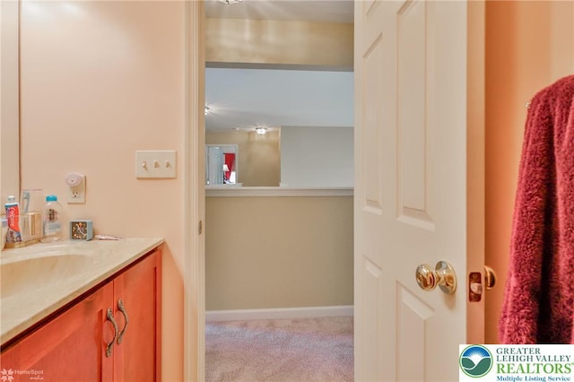 bathroom featuring vanity and baseboards
