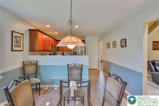 dining room featuring light tile patterned floors, recessed lighting, and baseboards
