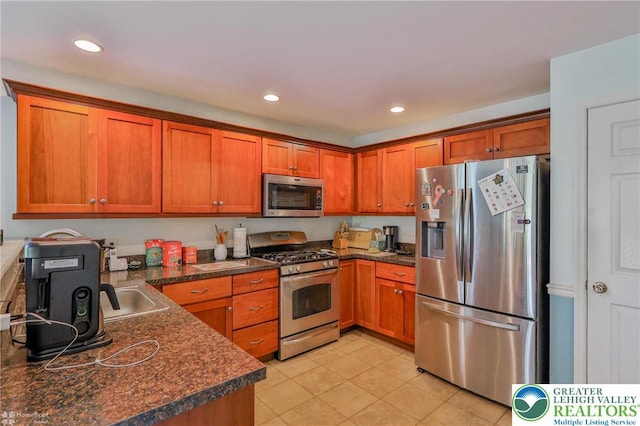 kitchen featuring stainless steel appliances, dark countertops, brown cabinets, light tile patterned floors, and recessed lighting