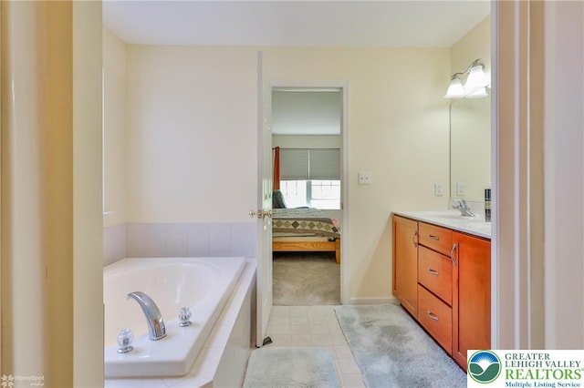 full bath with a garden tub, vanity, ensuite bath, and tile patterned flooring