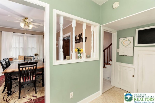 dining space with ceiling fan, stairway, and baseboards