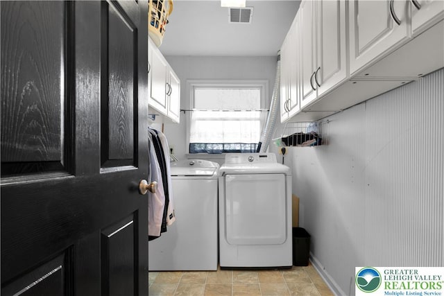 laundry area with cabinet space and washing machine and dryer