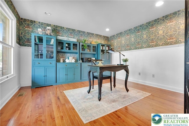 office with wallpapered walls, baseboards, light wood-style flooring, and recessed lighting