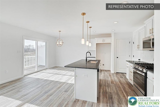 3280 Tepes Dr Unit 152, Allen Twp, PA 18067 - kitchen featuring appliances with stainless steel finishes, a sink, light wood-type flooring, white cabinets, and baseboards