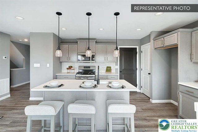 3280 Tepes Dr Unit 152, Allen Twp, PA 18067 - kitchen featuring stainless steel appliances, gray cabinetry, baseboards, a sink, and light countertops