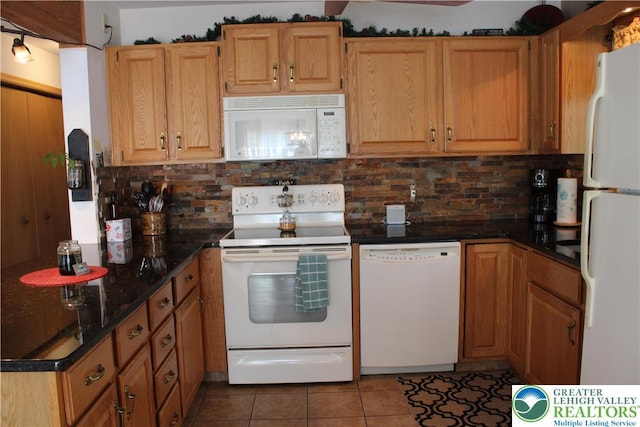 kitchen with white appliances, decorative backsplash, and tile patterned flooring