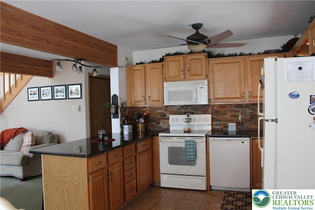 kitchen featuring white appliances, a peninsula, a ceiling fan, and decorative backsplash