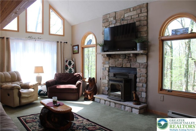 carpeted living area featuring a baseboard heating unit, healthy amount of natural light, high vaulted ceiling, and a wood stove