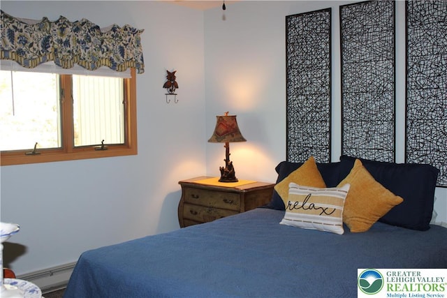 bedroom with a baseboard heating unit