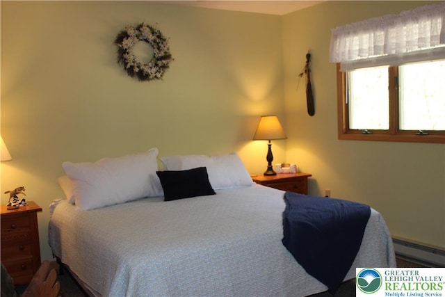 bedroom featuring a baseboard heating unit