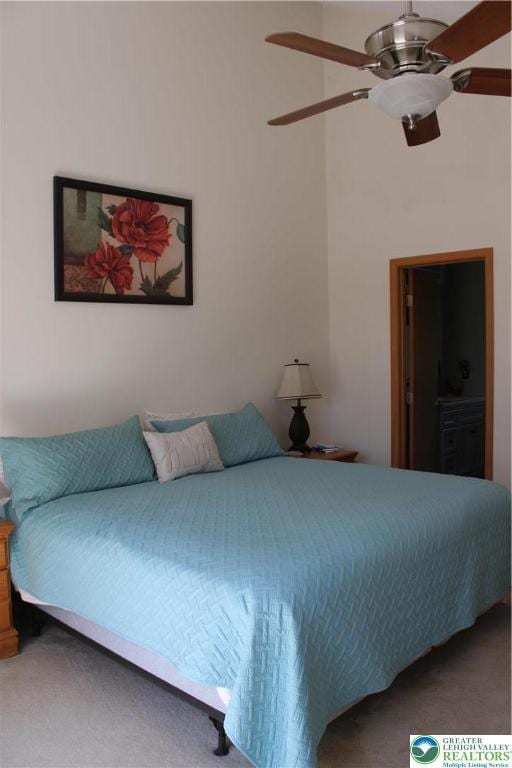 bedroom with ceiling fan and carpet floors