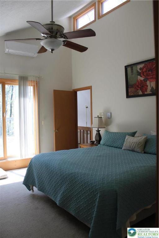 bedroom featuring a high ceiling, carpet flooring, and a ceiling fan