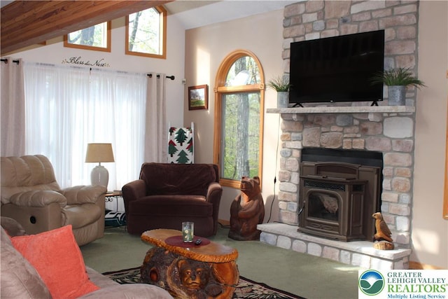 carpeted living area with lofted ceiling