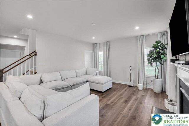 8202 Young Blvd, Upper Macungie Twp, PA 18051 - living area featuring wood finished floors, recessed lighting, stairway, and baseboards